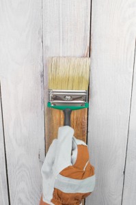 painting a wooden fence