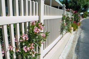 Vinyl is one of the most low-maintenance fencing options, but it still requires some upkeep.
